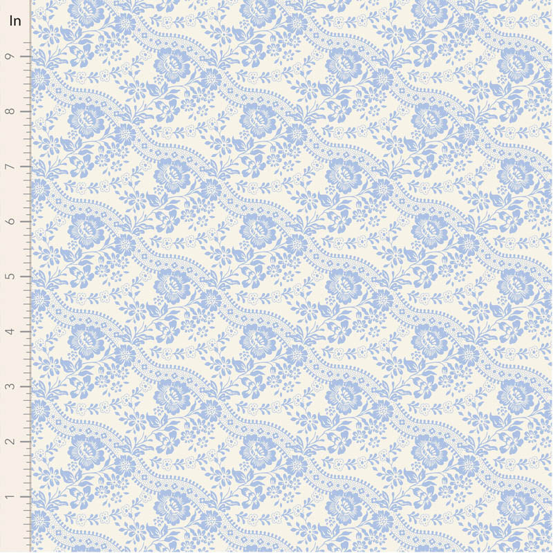 Blue floral patterned fabric on cream background, perfect for crafts and home decor.