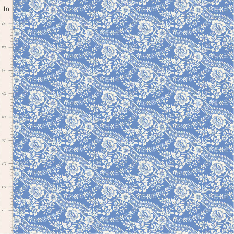Blue floral cotton fabric with white patterns, ideal for sewing crafts and quilting projects.