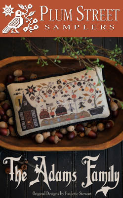 Plum Street Samplers 'The Adams Family' cross-stitch design, featuring autumn-themed patterns on fabric.