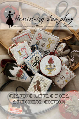 Heartstring Samplery Festive Little Fobs Stitching Edition, decorative cross-stitched fobs in various colors.