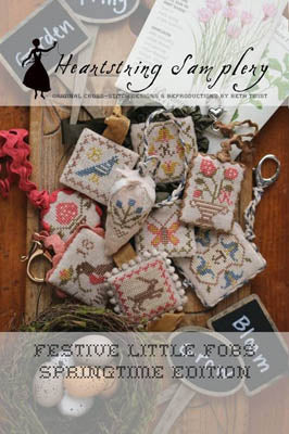 Spring-themed cross-stitch keychains in pastel colors, featuring floral and seasonal motifs.