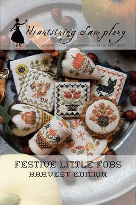 Festive cross-stitch fobs in harvest themes, featuring pumpkins and autumn colors by Heartstring Samplery.