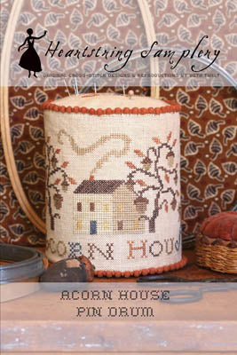 Acorn House pin drum, handmade decor with intricate stitching, featuring autumn colors and rustic design.
