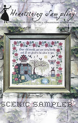 Scenic cross-stitch sampler with floral border, colorful house, and heartfelt quote, framed design by Heartstring Samplery.