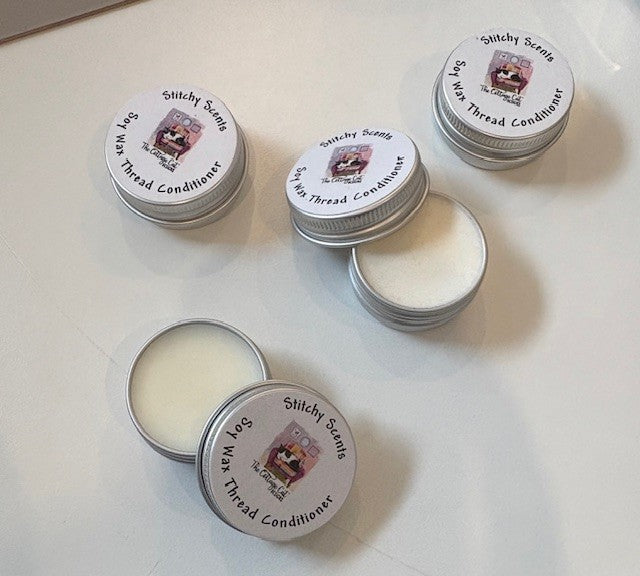 Set of five tins of Stitchy Scents soy wax thread conditioner, eco-friendly, ideal for sewing and crafting.
