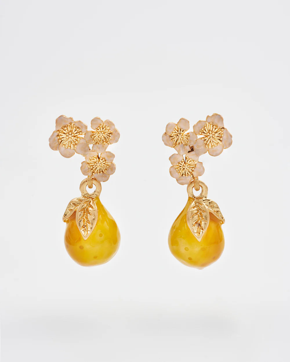 Gold floral drop earrings with yellow pear-shaped beads and leaf details, perfect for a playful look.