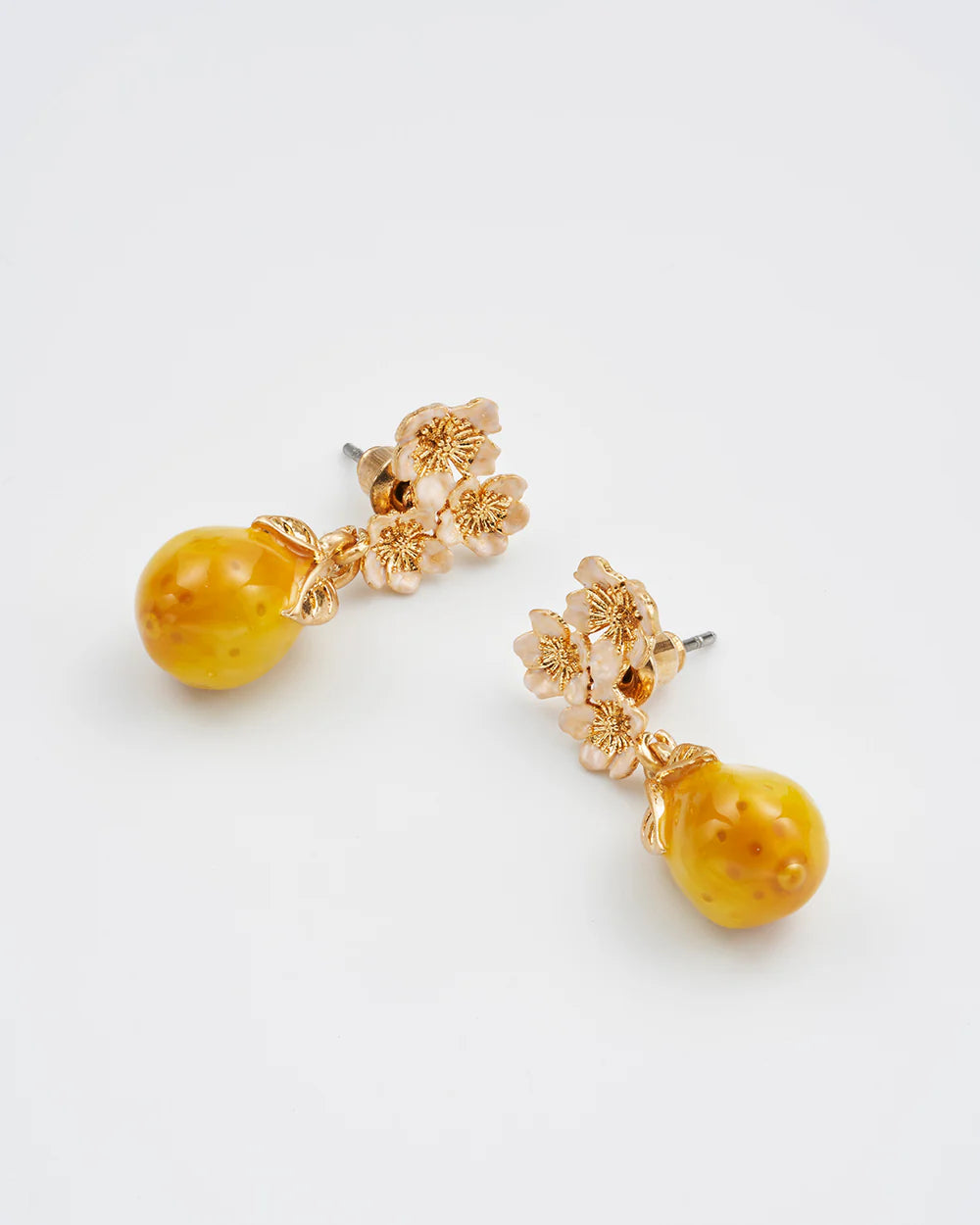 Elegant yellow gemstone drop earrings with floral gold accents, perfect for special occasions.