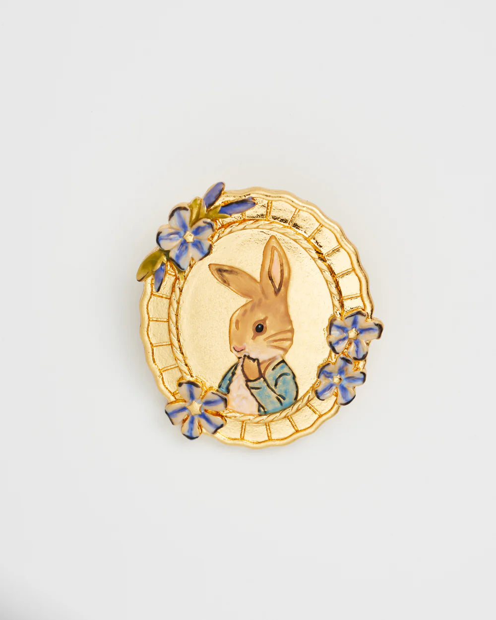 Gold bunny brooch with blue flowers, featuring a charming rabbit design and vintage style.