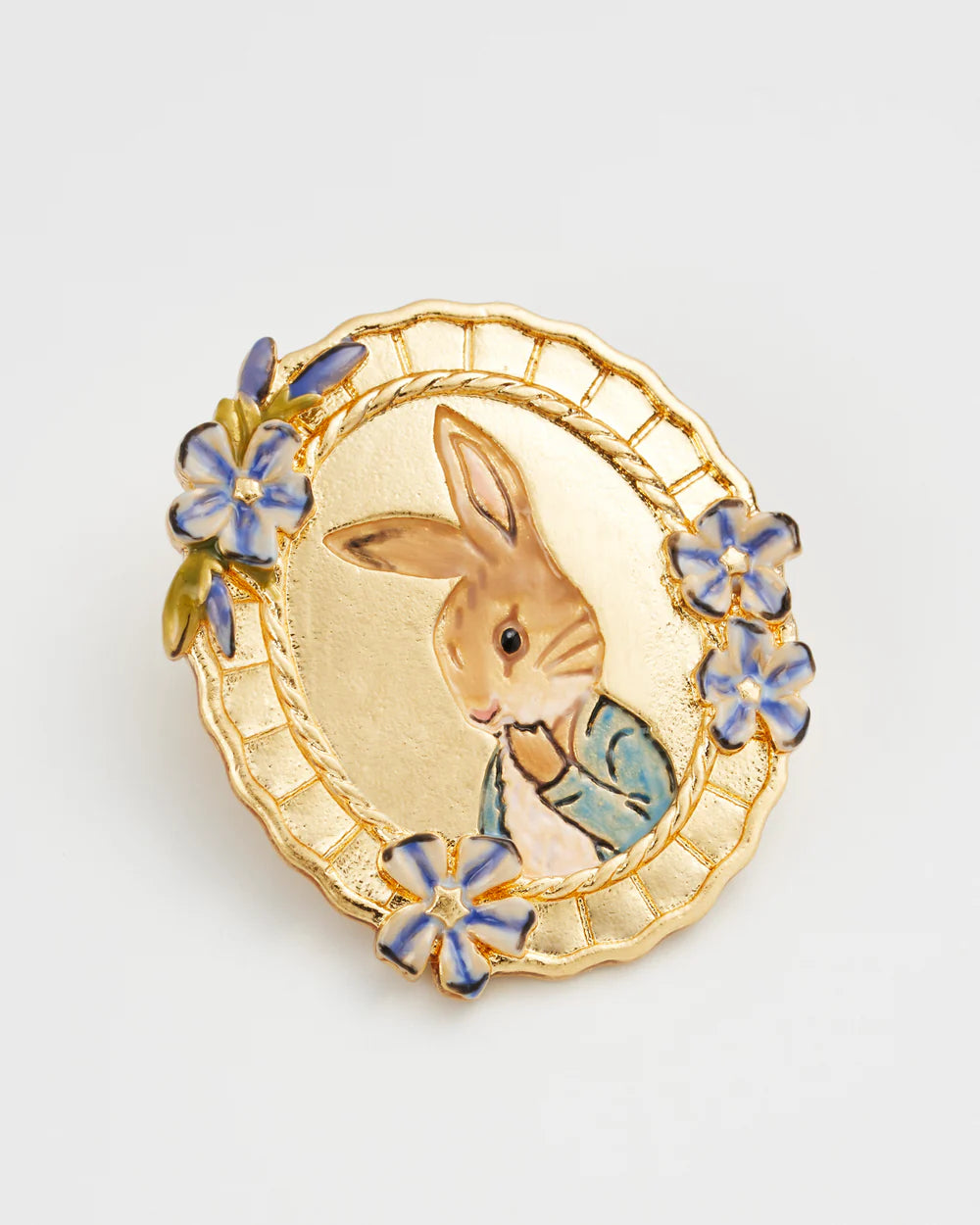 Gold rabbit brooch with floral design, featuring a painted bunny in a blue jacket, vintage style accessory.