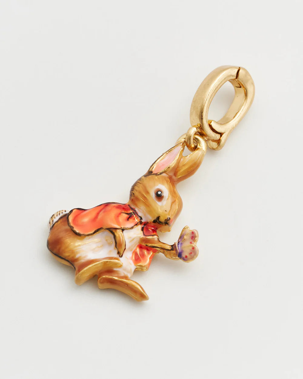 Charming rabbit charm in gold-tone metal with colorful enamel detailing, perfect for jewelry making.