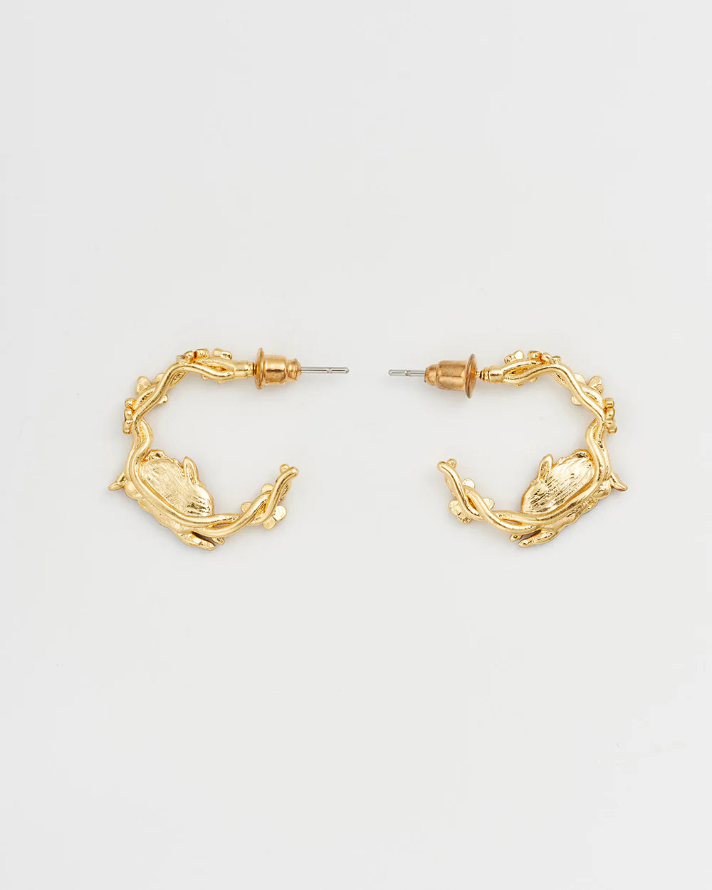 Gold animal-themed hoop earrings with intricate branch design, perfect for adding elegance to any outfit.