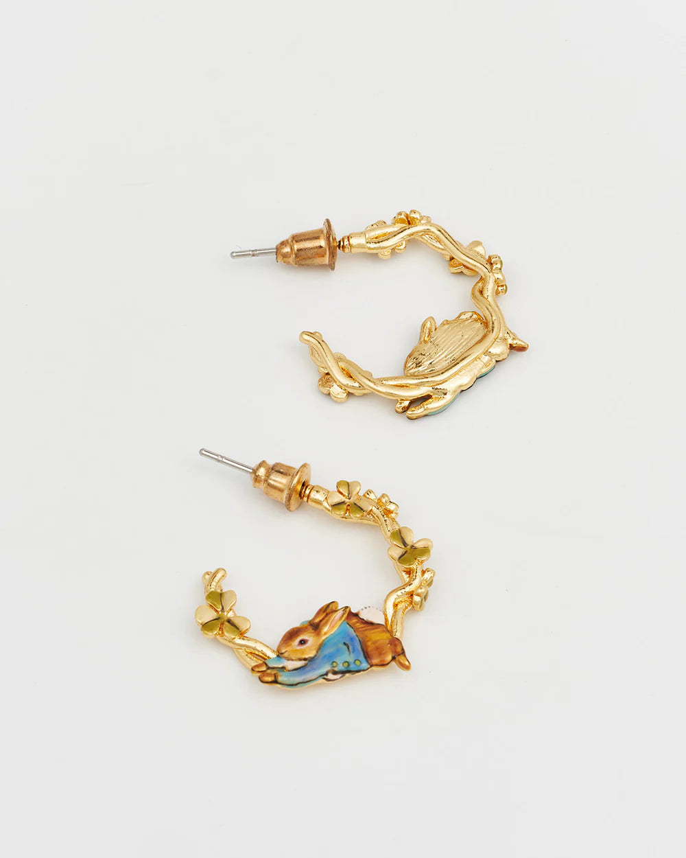 Gold-colored hoop earrings featuring a rabbit and floral design, perfect for whimsical fashion lovers.