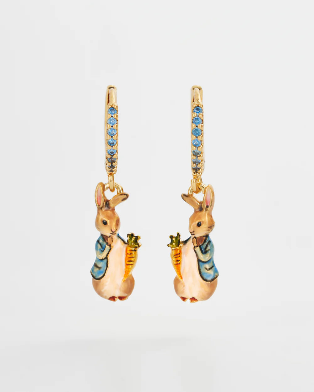 Gold-tone hoop earrings featuring cute bunny figures holding carrots, with blue gem accents.