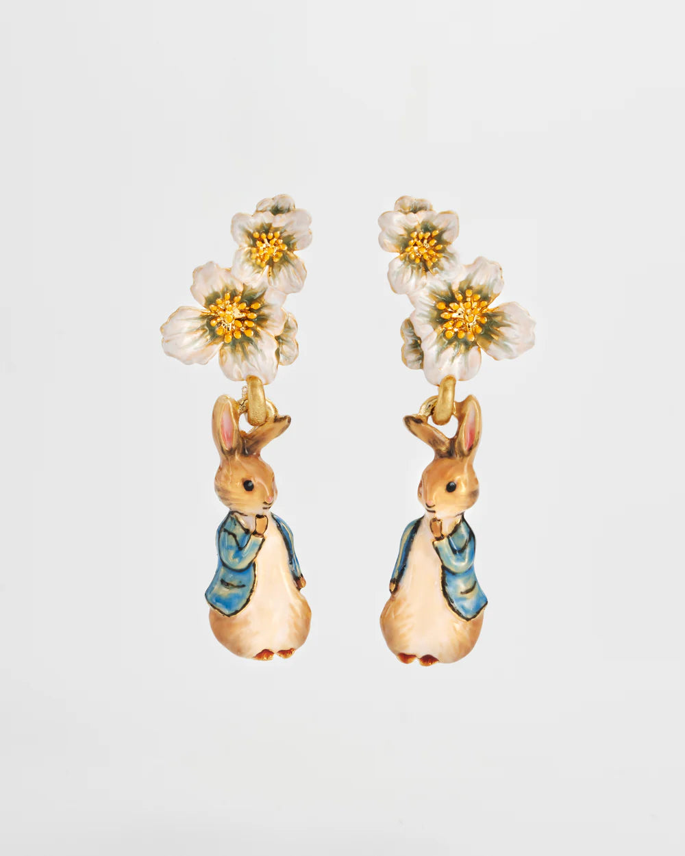 Whimsical rabbit earrings with floral accents, colorful enamel finish, perfect for springtime fashion.