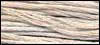 Natural cotton embroidery thread in creamy beige for sewing and crafting projects.