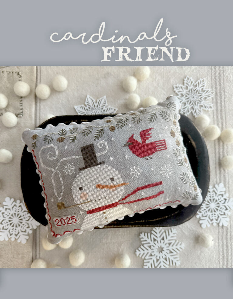 Cardinals Friend decorative pillow featuring a snowman and cardinal, made of fabric, perfect for winter decor.