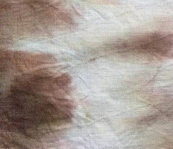 Close-up of textured beige and brown fabric, perfect for upholstery or craft projects.