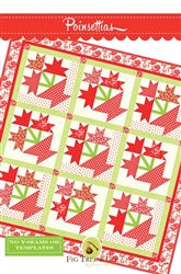 Poinsettia quilt pattern featuring red and green floral designs on a light background.