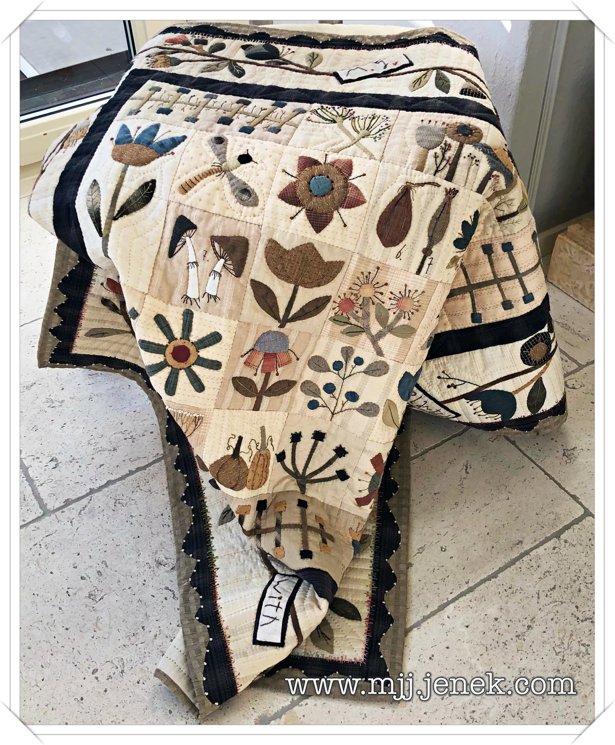 Handmade quilt featuring floral patterns in beige, blue, and brown colors, made from soft cotton fabric.