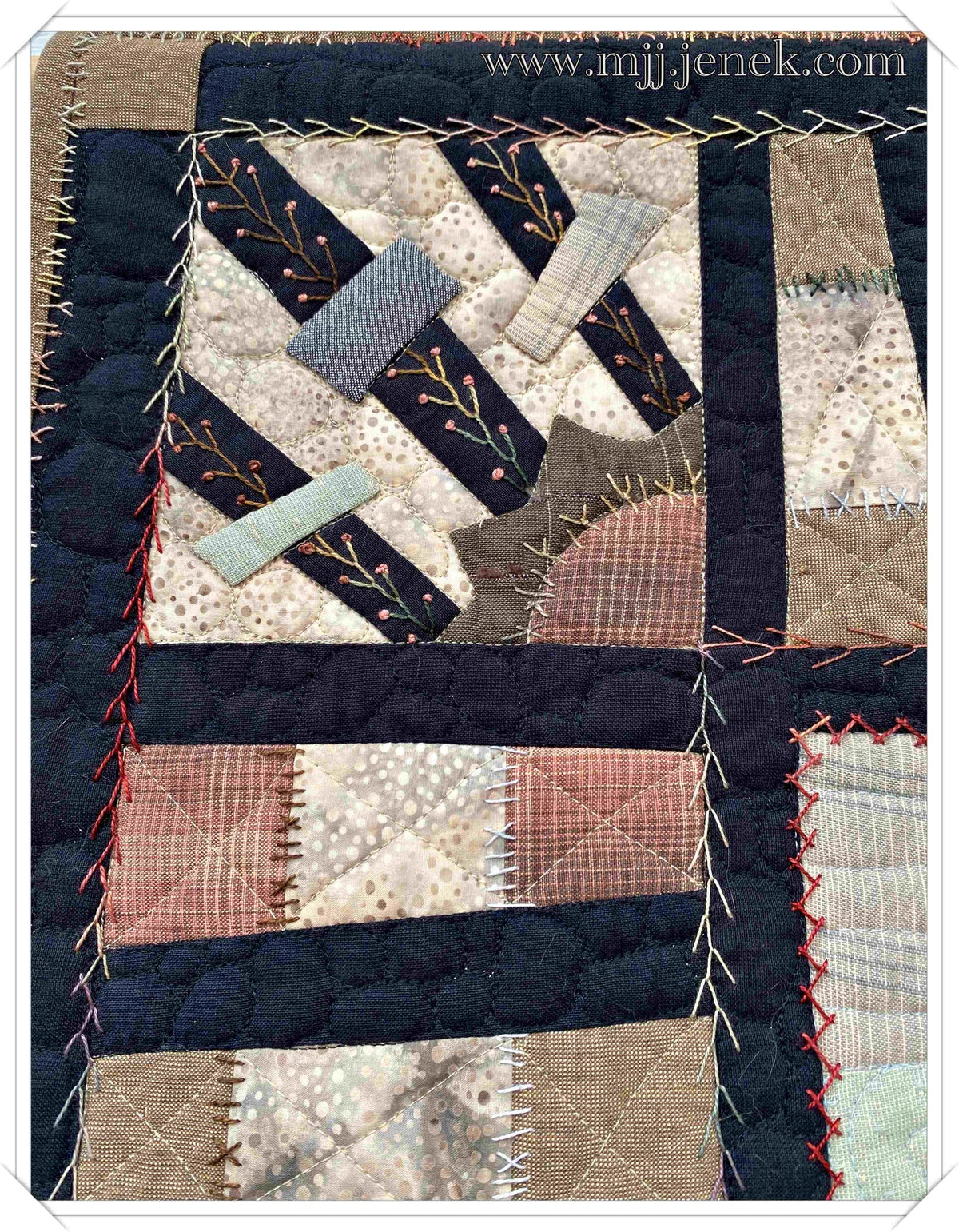 Handcrafted quilt patch featuring earthy tones, intricate stitching, and unique fabric patterns.
