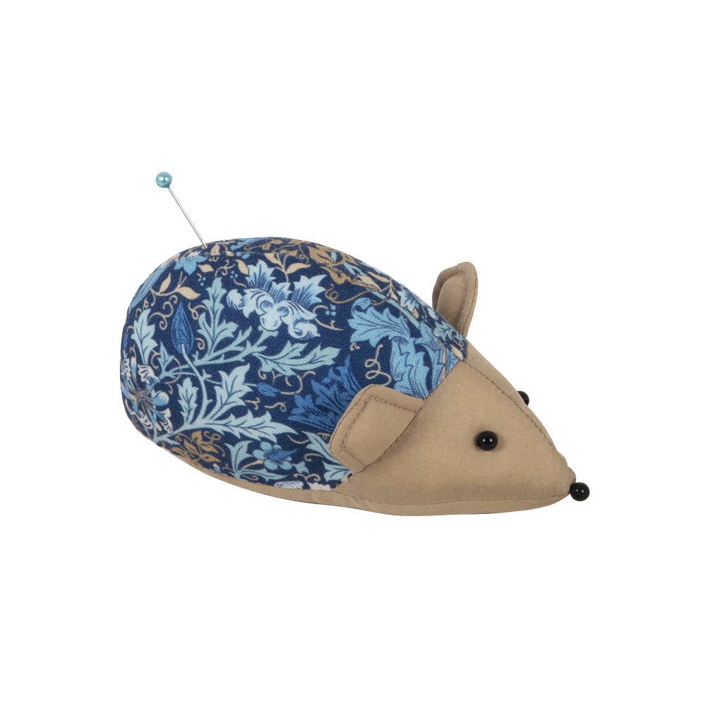Blue floral patterned hedgehog pincushion made of fabric and felt, ideal for sewing enthusiasts.