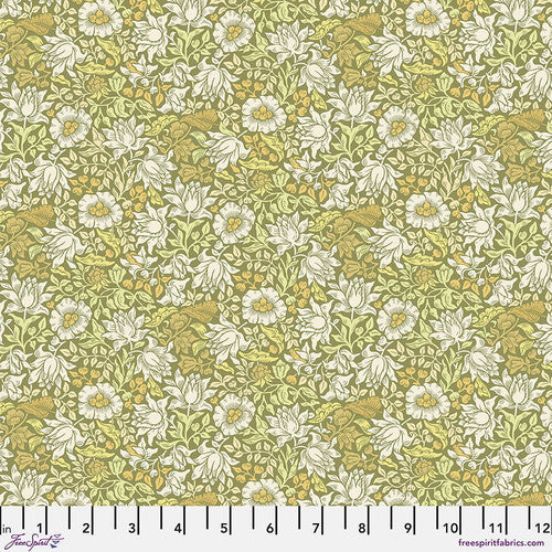 Floral print fabric in green and yellow, made of cotton, featuring small white flowers and intricate leaves.