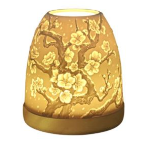 Elegant floral lamp with a cherry blossom design, warm yellow glass, perfect for home decor.