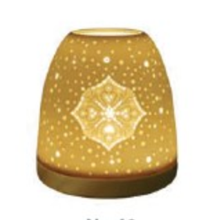 Golden decorative lamp with intricate patterns, perfect for ambiance and home decor.