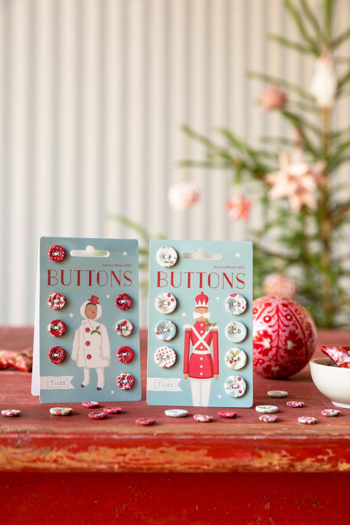 Set of festive buttons featuring holiday designs in red, white, and blue, perfect for crafting and decorations.