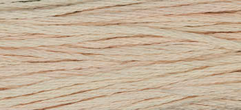 Light peach cotton embroidery thread for crafting and sewing projects.
