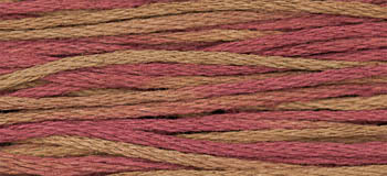 Colorful embroidery floss in shades of pink and brown, ideal for crafting and needlework projects.