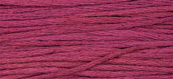 Soft cotton embroidery thread in vibrant berry color, perfect for crafting and sewing projects.