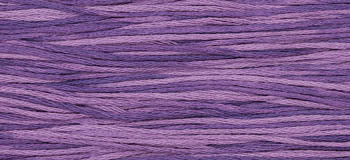Soft purple cotton yarn strands, ideal for knitting and crocheting projects.