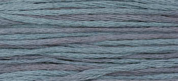 Soft cotton yarn in a gradient of blue hues, perfect for knitting and crochet projects.