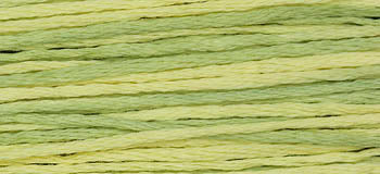 Soft gradient yarn in light green and yellow tones, perfect for knitting and crafting projects.