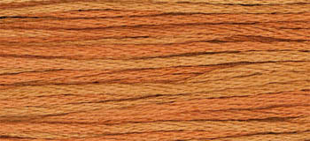 Orange and tan embroidery floss, perfect for crafting and sewing projects.