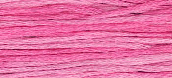 Soft pink embroidery floss in gradient shades, perfect for crafting and sewing projects.