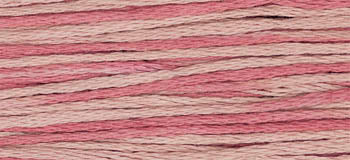 Cotton embroidery thread in pink and beige, ideal for stitching and crafting projects.