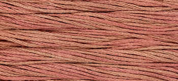 Soft cotton embroidery thread in coral pink, perfect for sewing and crafting projects.