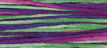 Colorful embroidery floss in shades of purple, green, and pink, perfect for crafting and stitching projects.
