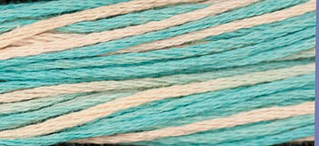 Turquoise and cream embroidery thread, soft cotton, ideal for crafts and stitching projects.