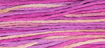 Variegated embroidery thread in shades of pink and cream, perfect for crafting and stitching projects.