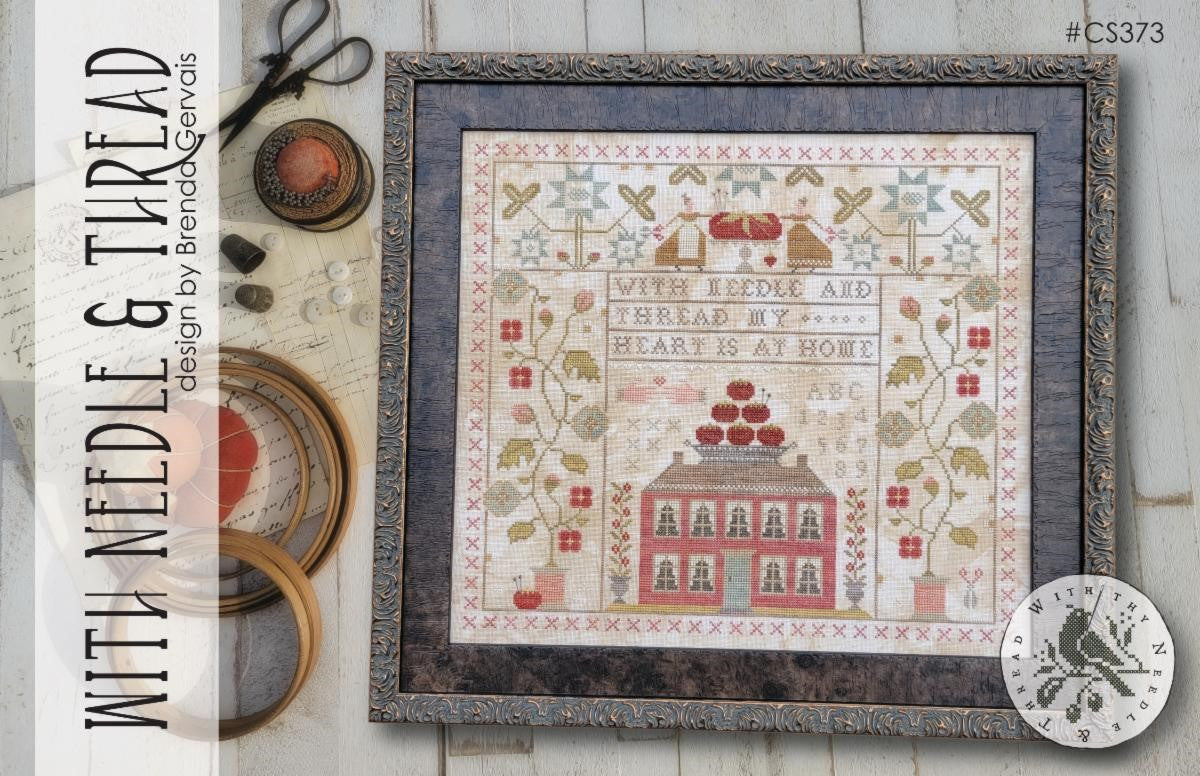 Framed cross stitch artwork 'With Needle & Thread' by Brenda Gervais, featuring home and floral motifs.