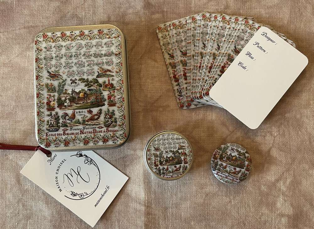 Vintage French card set with decorative tin, featuring floral patterns and images from 1901.