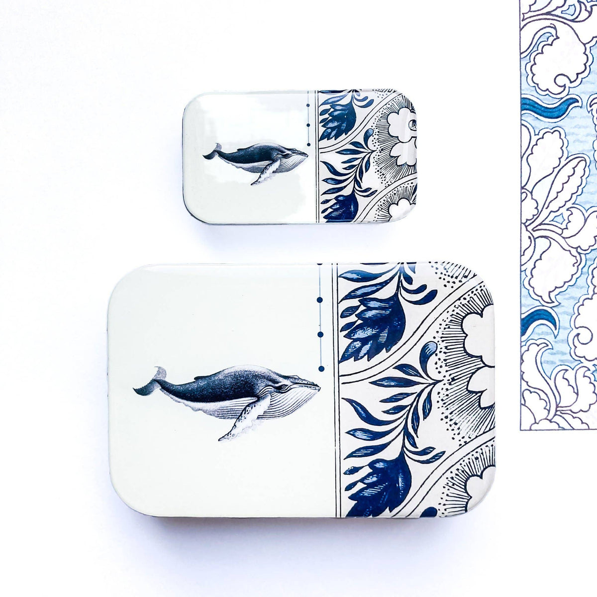 Set of two ceramic whale-themed trays, featuring intricate blue floral designs on a white background.