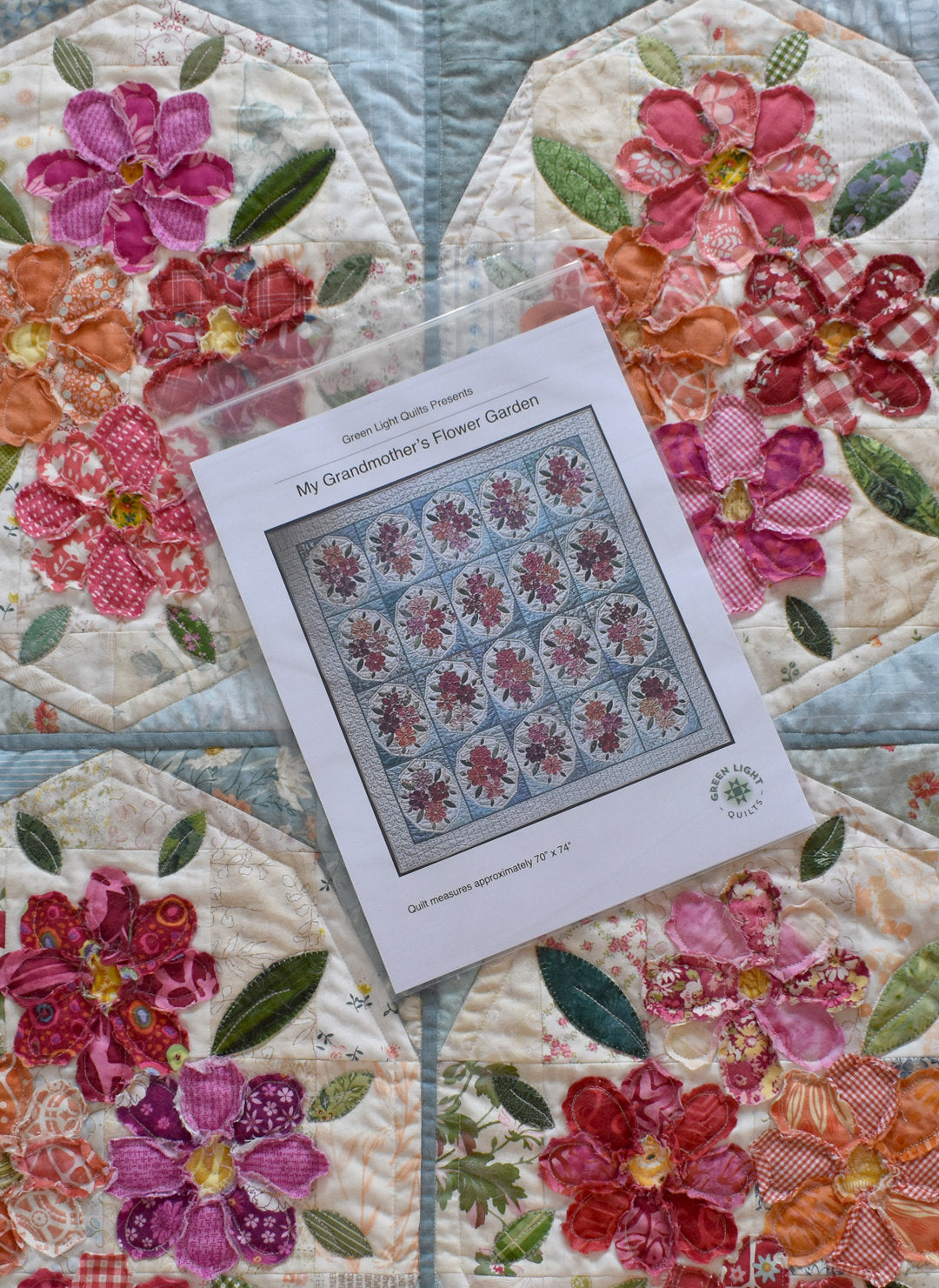 Colorful floral quilt pattern 'My Grandmother's Flower Garden', measures 70" x 74", featuring vibrant fabric flowers.