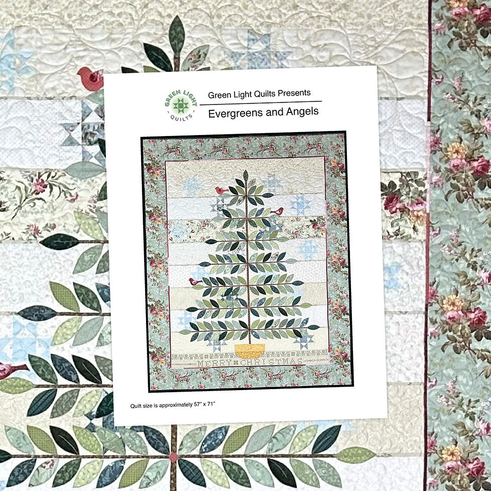 Evergreens and Angels quilt, 57" x 71", features floral patterns and Christmas tree design in green and red.