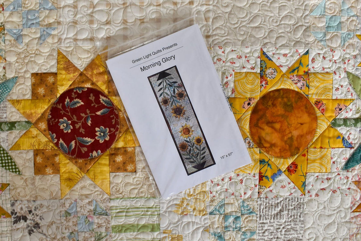 Morning Glory quilt pattern by Green Light Quilts, measures 15" x 57", features floral design on fabric.