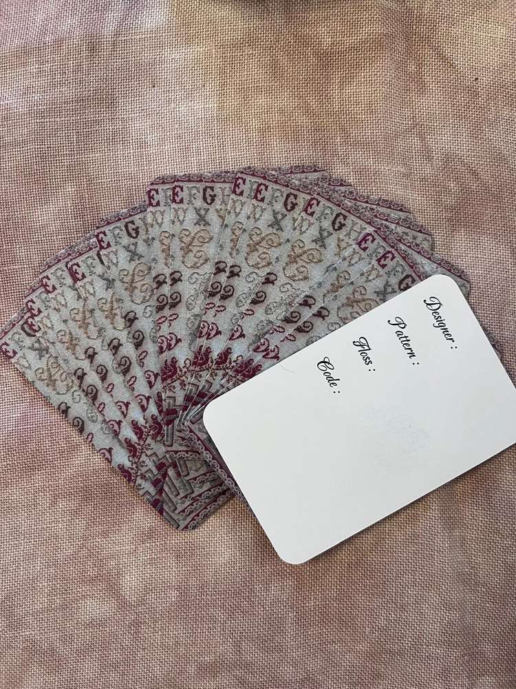 Vintage quilting pattern cards in maroon and beige, perfect for sewing and crafting projects.