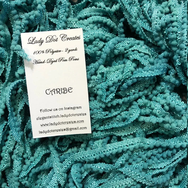 Hand-dyed polyester pom pom trim in vibrant Caribbean blue, 2 yards long, perfect for crafting.